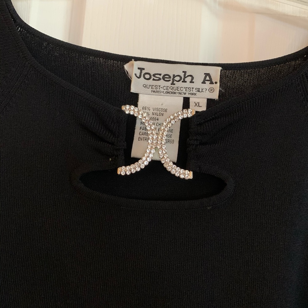 Black 3/4 sleeve with rhinestone detail. Size XL